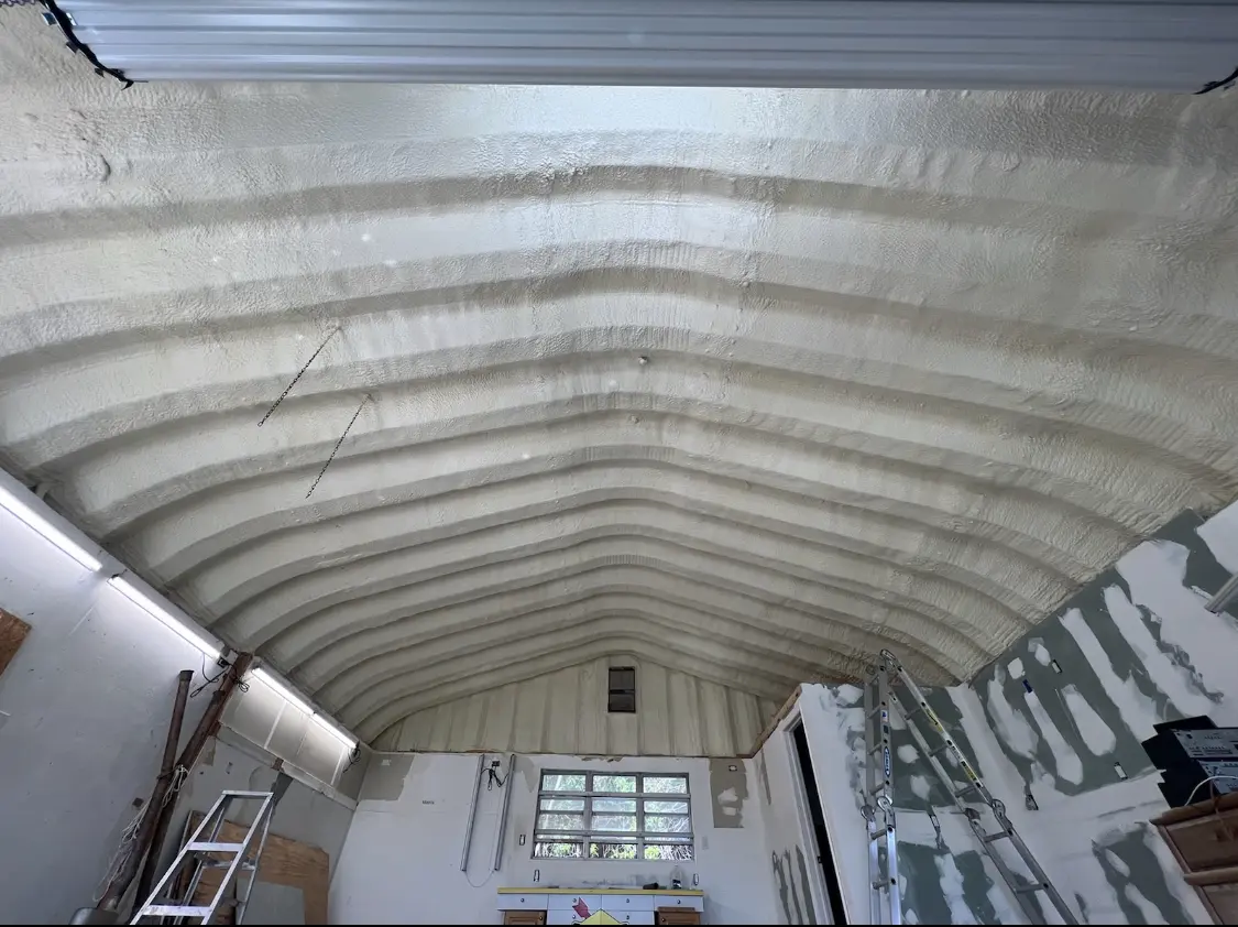 Spray polyurethane foam applied to the underside of a metal roof deck in Olive Branch